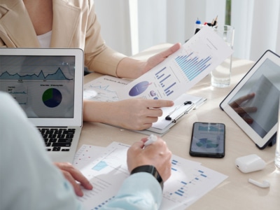managers reviewing sales reports